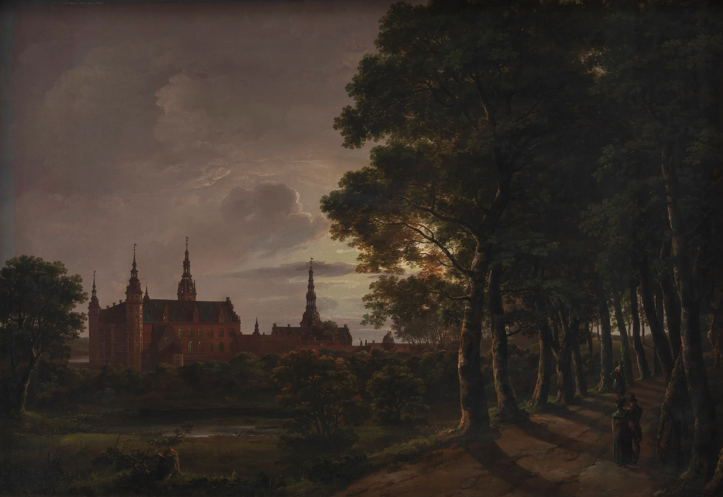 A Danish renaissance castle mirrored in still water under a high white moon and quiet clouds.