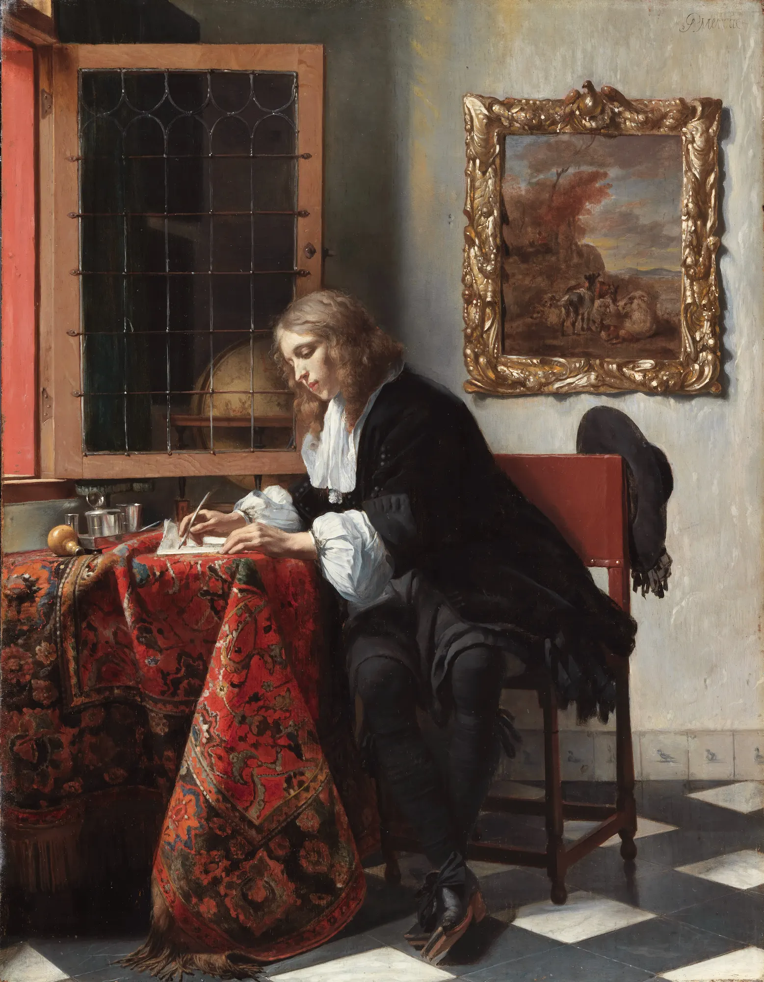 A young man in black sits at a carpeted table by a bright window, writing a letter, a globe on the ledge behind him.